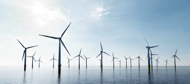 Offshore wind turbines farm on the ocean. Sustainable energy